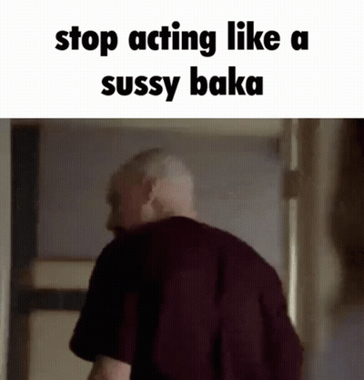A Man Is Standing In A Doorway With The Words `` Stop Acting Like A Sussy Baka '' Written On The Bottom . GIF