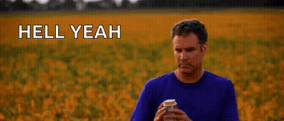 A Man Is Standing In A Field Holding A Can Of Soda And Says `` Hell Yeah '' . GIF