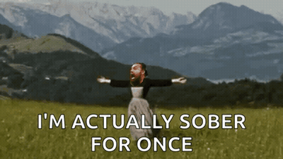A Man Is Standing In A Field With His Arms Outstretched And The Words " I 'M Actually Sober For Once " GIF
