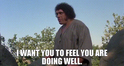 A Man Is Standing In A Field With Trees In The Background And Says `` I Want You To Feel You Are Doing Well '' . GIF