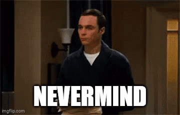 A Man Is Standing In A Hallway With The Words `` Nevermind '' Written On It . GIF