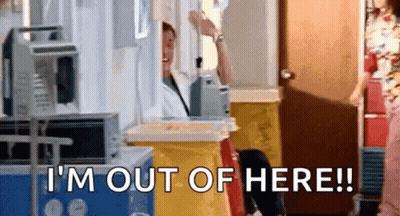 A Man Is Standing In A Hospital Room Talking On A Cell Phone And Says `` I 'M Out Of Here '' . GIF