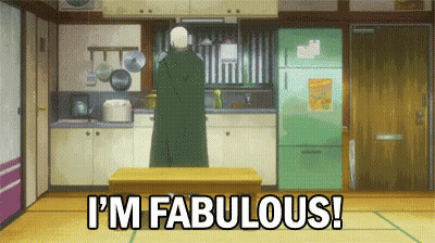 A Man Is Standing In A Kitchen And Says I 'M Fabulous . GIF
