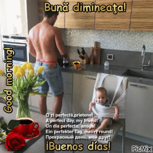 A Man Is Standing In A Kitchen With A Baby In A High Chair And A Cup Of Coffee On The Counter GIF
