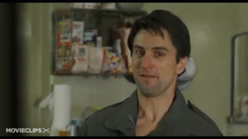 A Man Is Standing In A Kitchen With A Movie Clips Logo On The Bottom GIF