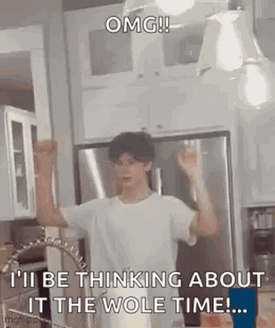 A Man Is Standing In A Kitchen With His Arms In The Air And A Sink . GIF