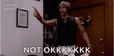 A Man Is Standing In A Room Pointing At The Camera And Saying `` Not Okkkk '' . GIF