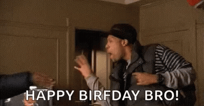 A Man Is Standing In A Room With A Red Balloon In The Background And Says `` Happy Birfday Bro ! '' GIF
