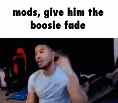 A Man Is Standing In A Room With The Words `` Mods , Give Him The Boosie Fade '' Written On The Screen . GIF