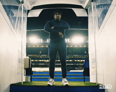 A Man Is Standing In A Tunnel That Says Heitse On The Bottom GIF