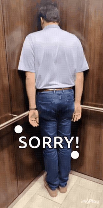 A Man Is Standing In An Elevator And Says Sorry GIF