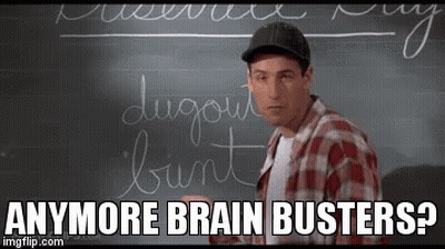 A Man Is Standing In Front Of A Blackboard With Writing On It . GIF
