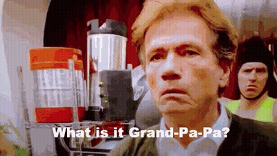 A Man Is Standing In Front Of A Blender With The Words `` What Is It Grand-Pa-Pa '' . GIF