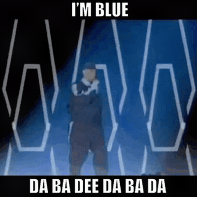 A Man Is Standing In Front Of A Blue Background With The Words `` I 'M Blue '' On It . GIF