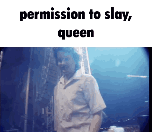 A Man Is Standing In Front Of A Blue Background With The Words Permission To Slay Queen Above Him GIF
