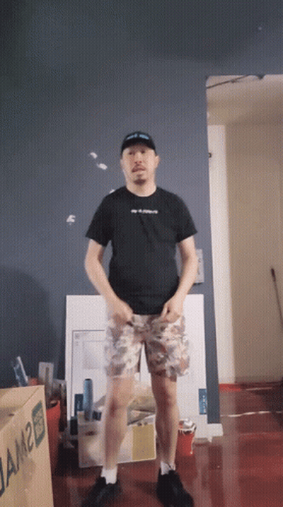 A Man Is Standing In Front Of A Box That Says Jam2 GIF
