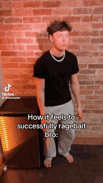A Man Is Standing In Front Of A Brick Wall With His Eyes Closed And A Necklace Around His Neck . GIF