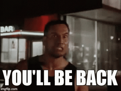 A Man Is Standing In Front Of A Building With The Words `` You 'Ll Be Back '' . GIF