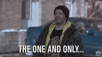 A Man Is Standing In Front Of A Car And Talking About The One And Only . GIF