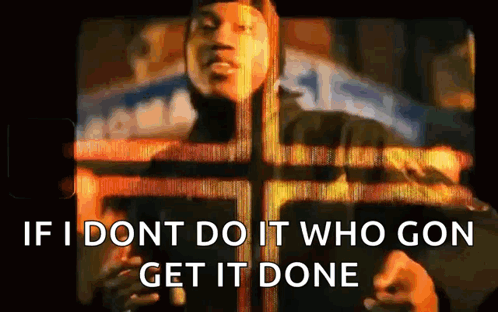 A Man Is Standing In Front Of A Cross With The Words `` If I Don T Do It Who Gon Get It Done '' . GIF