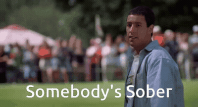 A Man Is Standing In Front Of A Crowd And The Words Somebody 'S Sober Are On The Screen Behind Him GIF