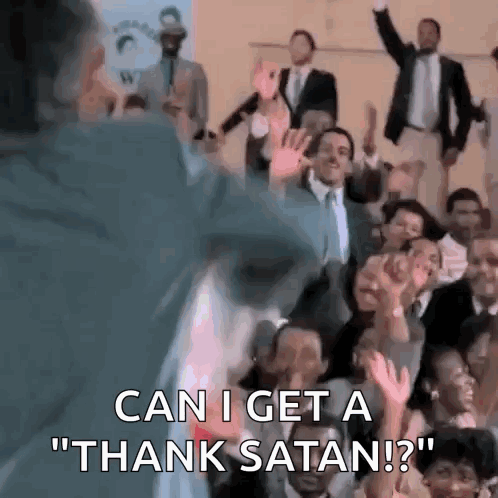 A Man Is Standing In Front Of A Crowd Of People And Saying `` Can I Get A Thank Satan ? '' . GIF