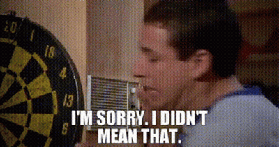 A Man Is Standing In Front Of A Dart Board And Says I 'M Sorry I Did N't Mean That GIF