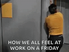 A Man Is Standing In Front Of A Door With The Words `` How We All Feel At Work On A Friday '' Written On It . GIF