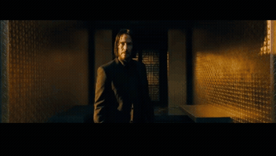A Man Is Standing In Front Of A Fountain And The Word Parlay Is On The Bottom Right GIF