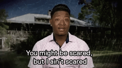 A Man Is Standing In Front Of A House And Saying You Might Be Scared GIF