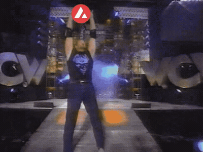 A Man Is Standing In Front Of A Huge Explosion With A Red Arrow Pointing To His Chest GIF