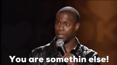 A Man Is Standing In Front Of A Microphone And Saying `` You Are Somethin Else ! '' GIF