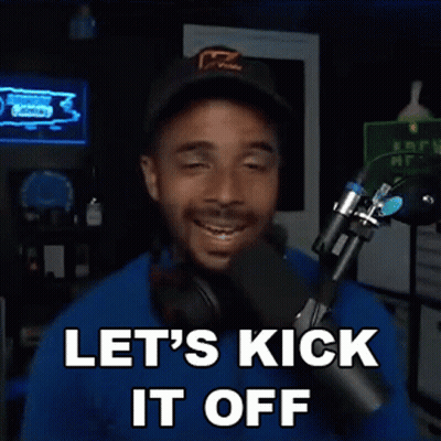 A Man Is Standing In Front Of A Microphone With His Eyes Closed And Says Let 'S Kick It Off . GIF