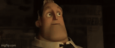 A Man Is Standing In Front Of A Newspaper That Says `` Incredible Hundreds '' . GIF