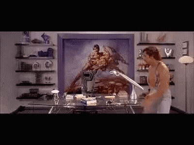 A Man Is Standing In Front Of A Painting Of A Man On A Horse GIF