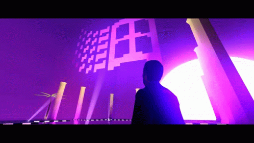 A Man Is Standing In Front Of A Purple Wall That Says ' I ' On It GIF