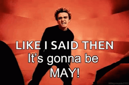 A Man Is Standing In Front Of A Red Background And Says `` Like I Said Then It 'S Gonna Be May '' . GIF