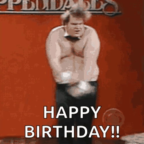 A Man Is Standing In Front Of A Red Wall And Says Happy Birthday ! GIF