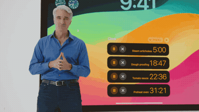 A Man Is Standing In Front Of A Screen That Says 9:41 GIF