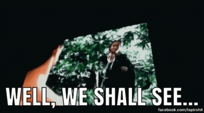 A Man Is Standing In Front Of A Screen With The Words `` Well , We Shall See ... '' Written On It . GIF