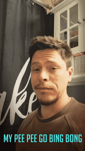 A Man Is Standing In Front Of A Shower Curtain With The Words My Pee Pee Go Bing Bong Written Below Him GIF