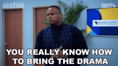 A Man Is Standing In Front Of A Sign That Says Brookhaven GIF