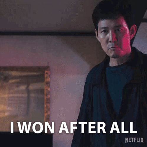 A Man Is Standing In Front Of A Sign That Says I Won After All Netflix GIF