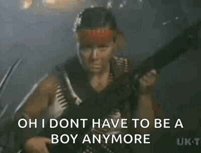 A Man Is Standing In Front Of A Sign That Says `` Oh I Don T Have To Be A Boy Anymore '' GIF