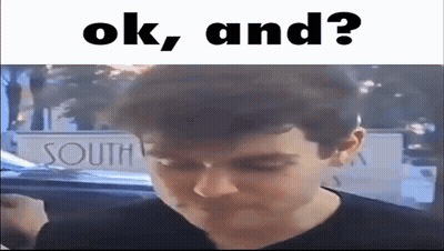 A Man Is Standing In Front Of A Sign That Says `` Ok , And ? '' . GIF