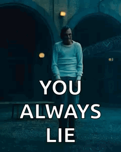 A Man Is Standing In Front Of A Sign That Says `` You Always Lie '' GIF