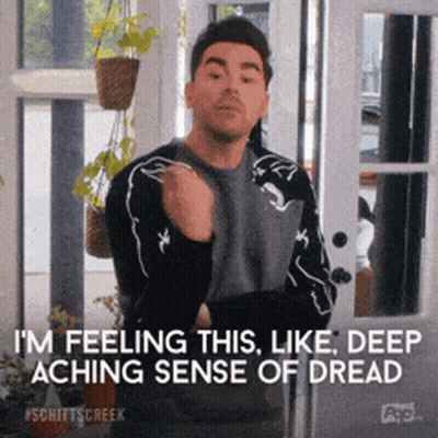 A Man Is Standing In Front Of A Sliding Glass Door And Says I 'M Feeling This Like Deep Aching Sense Of Dread GIF