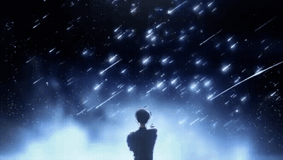 A Man Is Standing In Front Of A Starry Night Sky Looking Up At The Stars . GIF