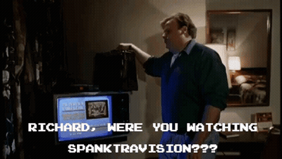A Man Is Standing In Front Of A Television With The Words " Richard Were You Watching Spanktravision " On The Screen GIF