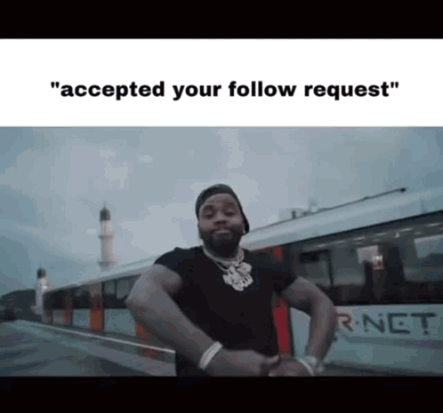 a man is standing in front of a train with the caption " accepted your follow request " .